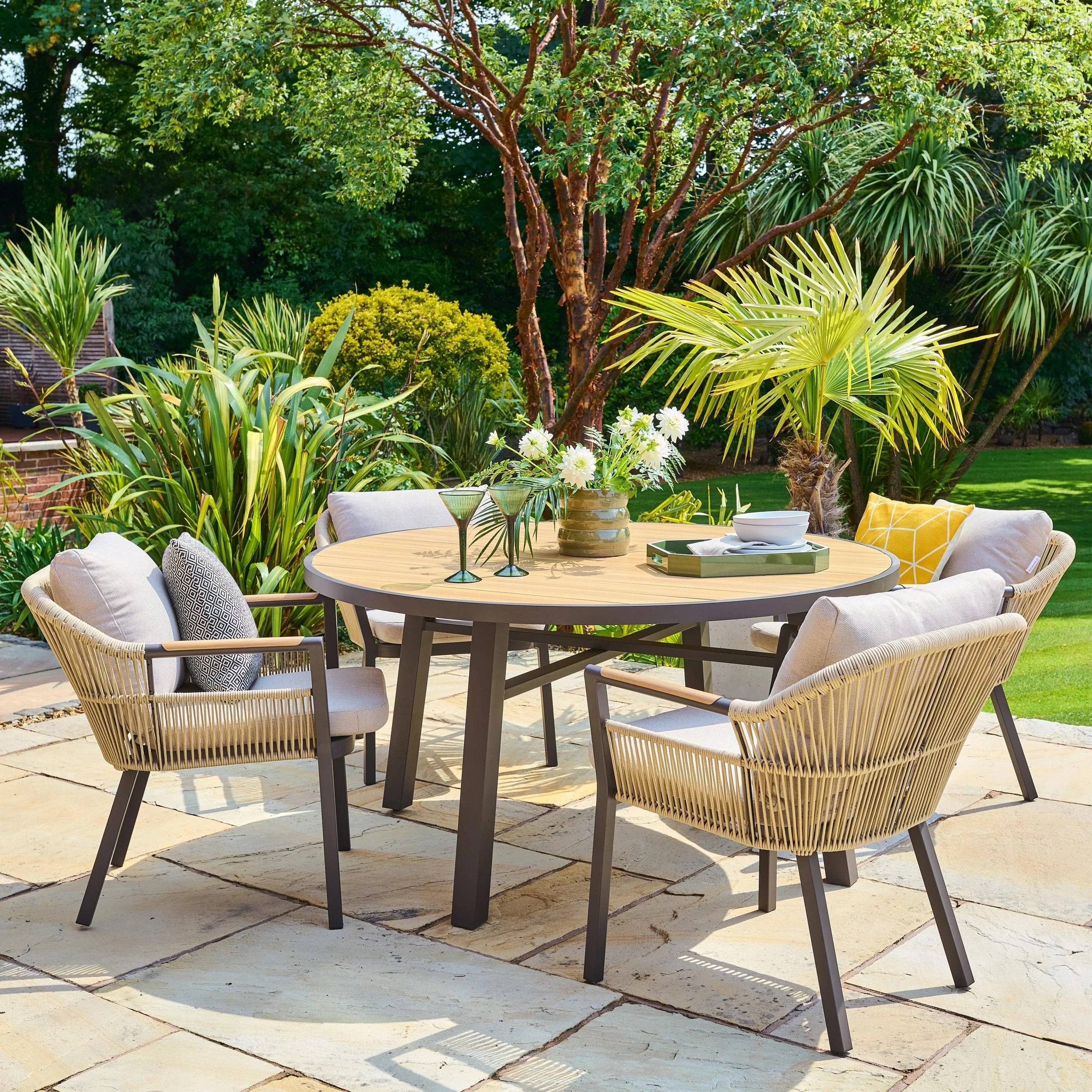 Garden dining set for Dubai terrace with weather-resistant table and chairs
