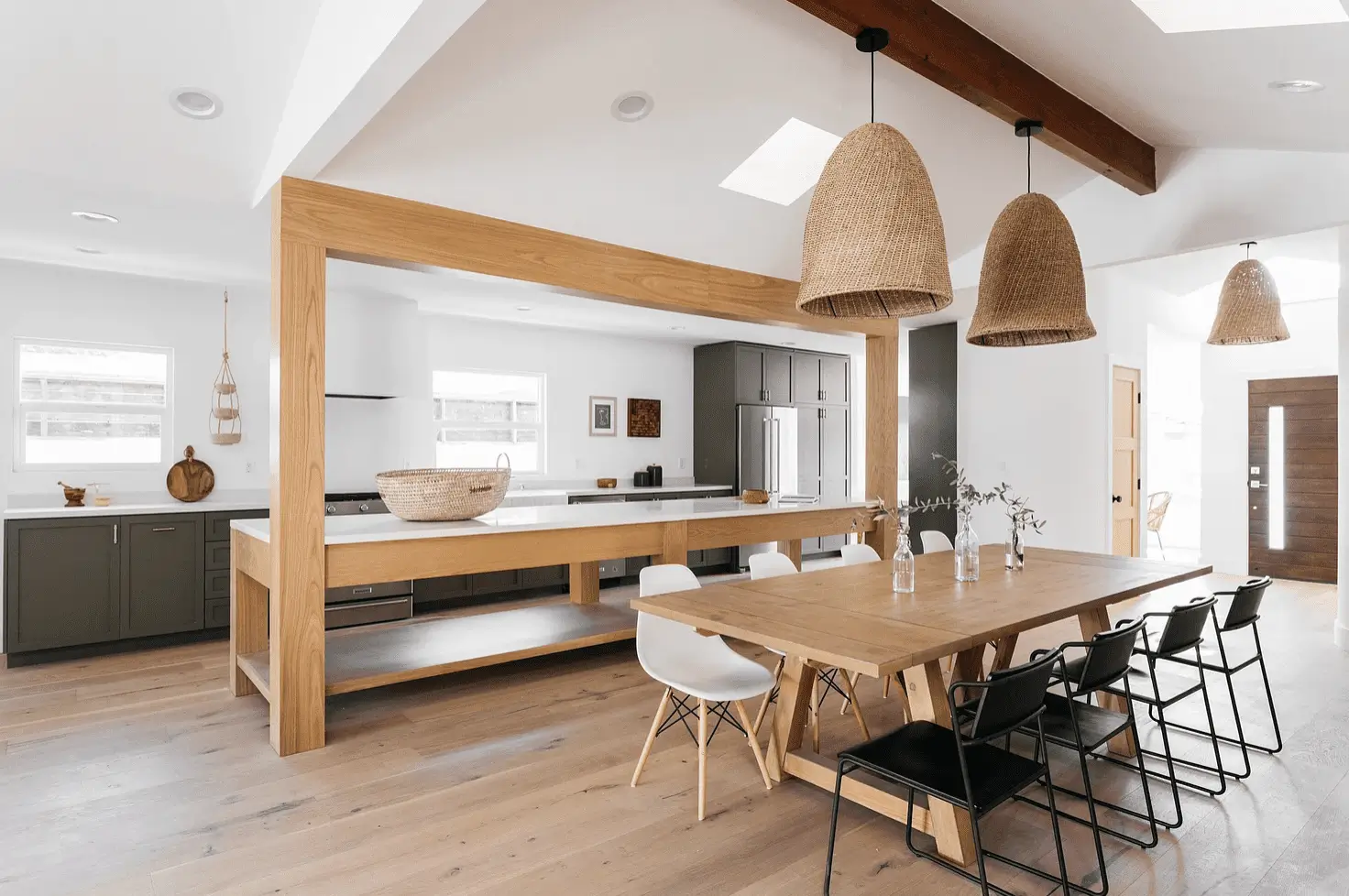 Open plan island kitchen design connecting kitchen and living areas in Dubai