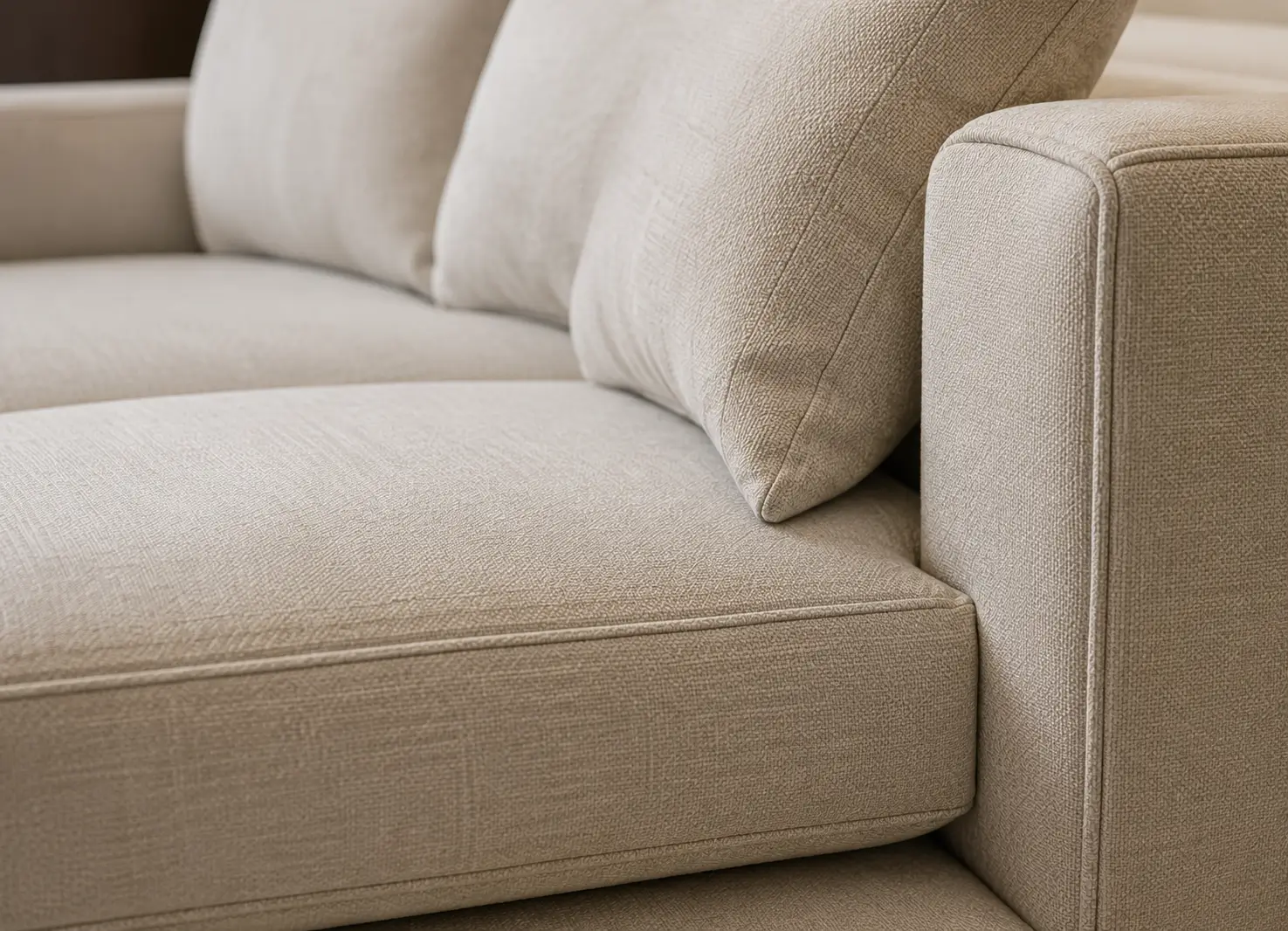 Close-up of premium sofa stitching and high-density foam padding quality