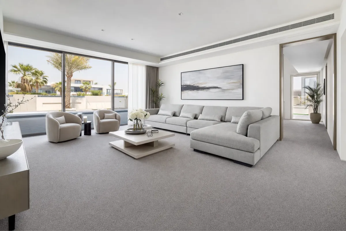 Wall to wall carpet in a Dubai living room fitted edge to edge in soft grey