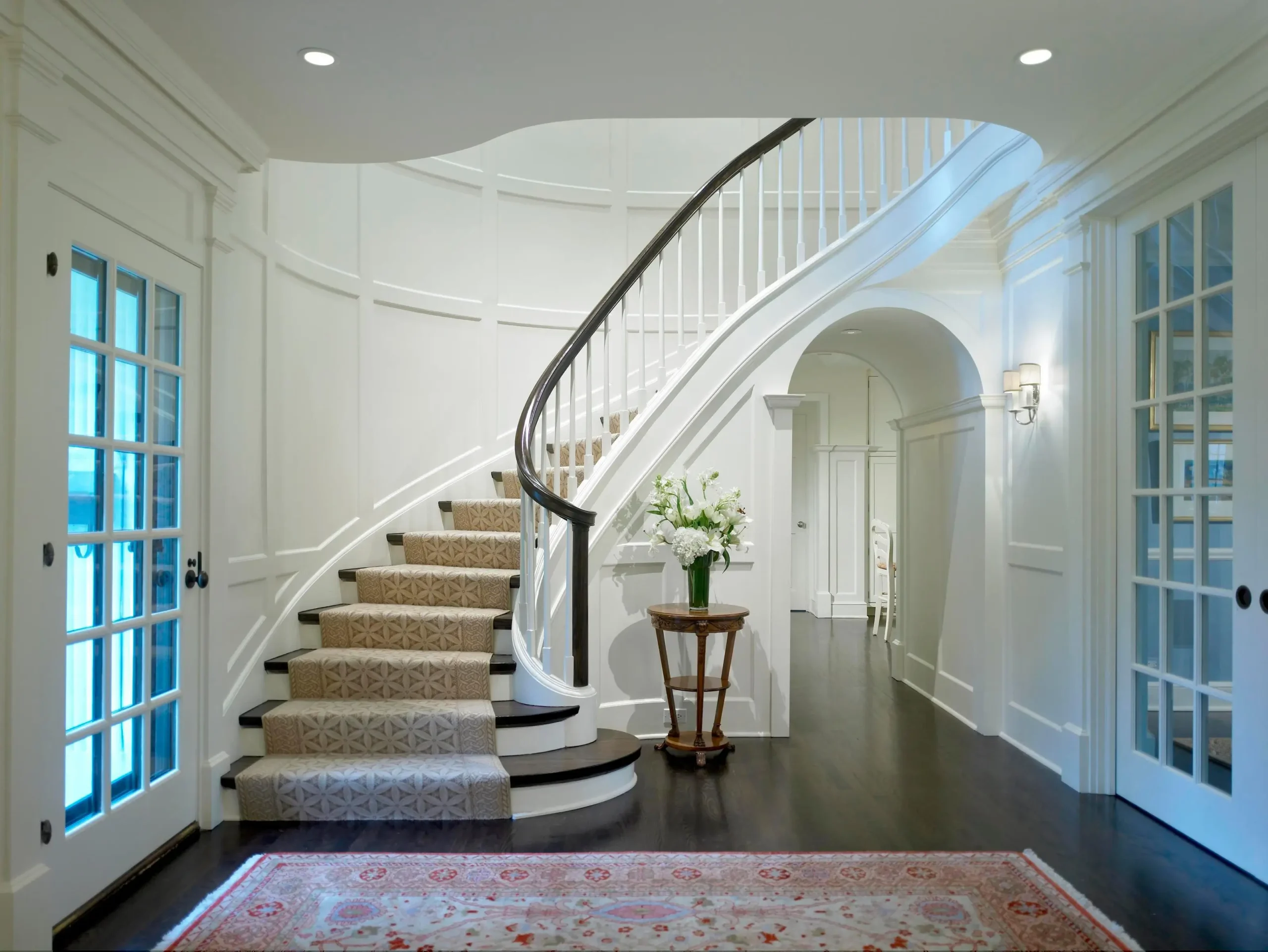 Curved winder staircase with custom carpet runner Dubai